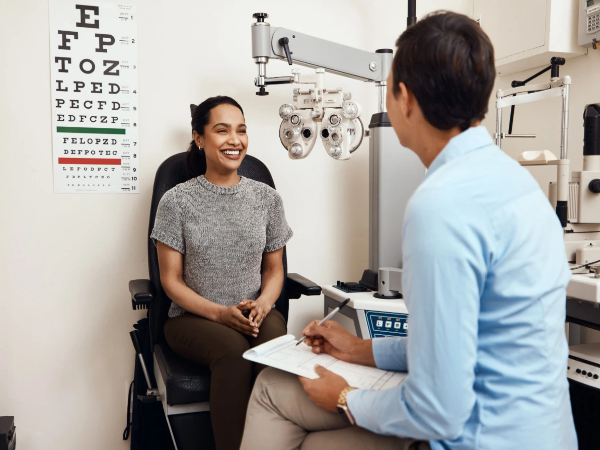 young woman and eye doctor during eye exam