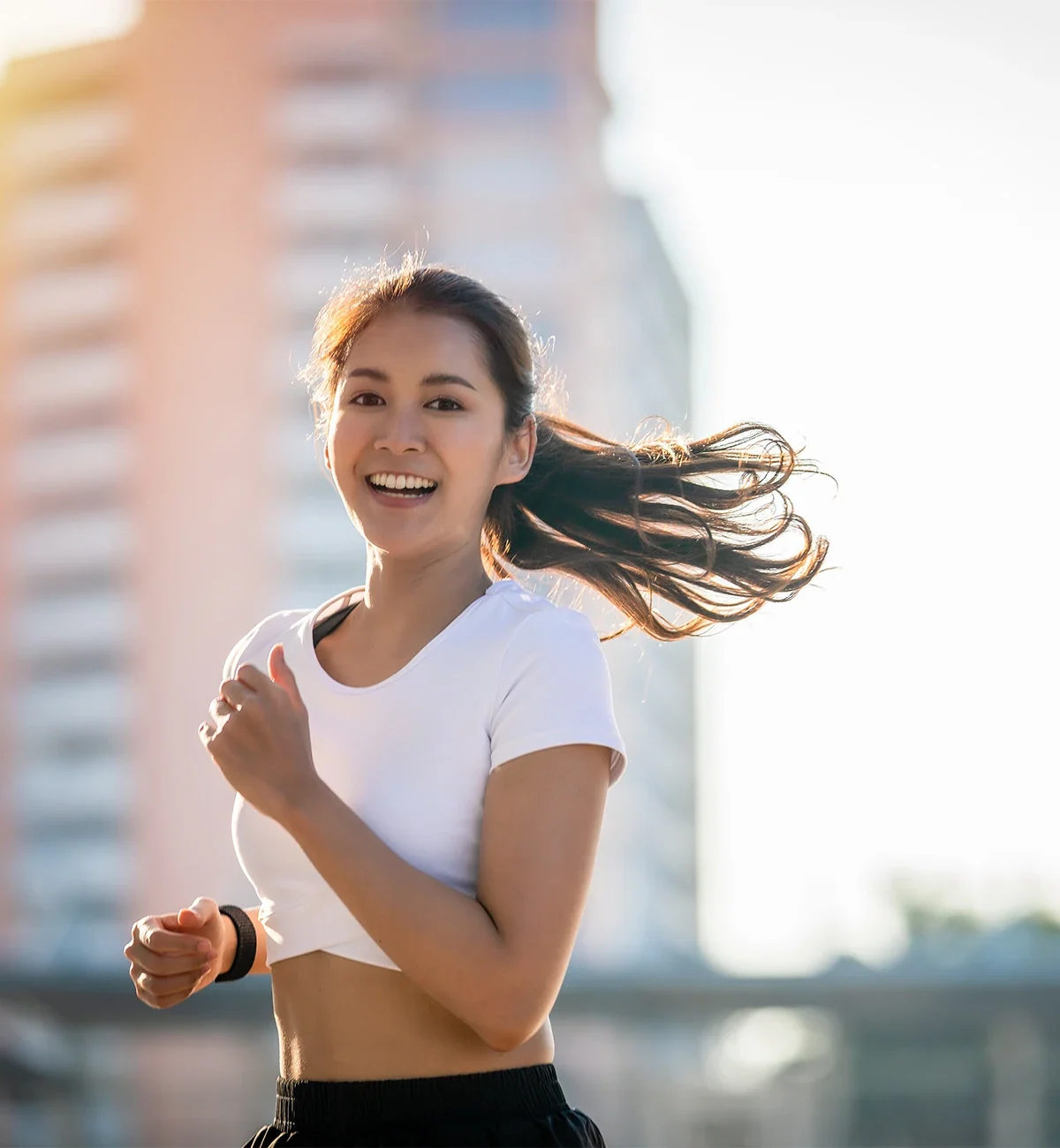 Young woman jogging in city after having LASIK