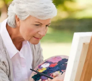 senior woman painting