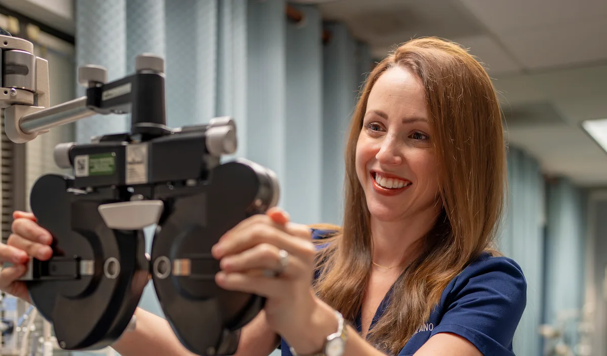 Dr. Lozano using phoropter